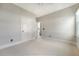 Neutral bedroom features two bright windows, carpeted floors, and fresh neutral paint at 23 Felix St, Charleston, SC 29403