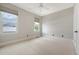Neutral bedroom features two bright windows, carpeted floors, and fresh neutral paint at 23 Felix St, Charleston, SC 29403