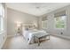Cozy bedroom featuring a bed with accent pillows, a ceiling fan, plush carpet, and windows with natural light at 23 Felix St, Charleston, SC 29403