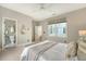 Bedroom with views into the bathroom. Features plush carpet, a ceiling fan, and a decorative mirror at 23 Felix St, Charleston, SC 29403