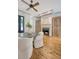 Bright dining area with a fireplace, two storage cabinets, a round table and wooden floors throughout at 23 Felix St, Charleston, SC 29403