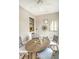 Dining area boasts stylish furniture and decor, lit by a modern ceiling fan at 23 Felix St, Charleston, SC 29403