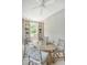 Dining area boasts stylish furniture and decor, lit by a modern ceiling fan at 23 Felix St, Charleston, SC 29403