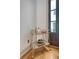 Dining area with a gold bar cart and a partially visible black trimmed door with glass panes at 23 Felix St, Charleston, SC 29403
