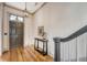 Bright foyer showcasing hardwood floors, staircase with runner, and stylish decor at 23 Felix St, Charleston, SC 29403