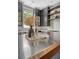 Kitchen with gray cabinets, stainless steel appliances and a center island with barware on top of the metal surface at 23 Felix St, Charleston, SC 29403