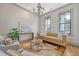 Comfortable living room with hardwood floors, modern sofa, and bright natural light at 23 Felix St, Charleston, SC 29403