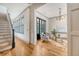 Beautiful living room featuring hardwood floors, elegant furniture, and staircase at 23 Felix St, Charleston, SC 29403