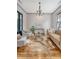 Sunlit living room with hardwood floors, stylish furnishings, and elegant lighting at 23 Felix St, Charleston, SC 29403
