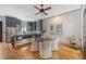 Open-concept kitchen and dining area with wood floors, stylish decor, and stainless appliances at 23 Felix St, Charleston, SC 29403