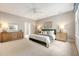 Bright main bedroom features comfortable bedding, tasteful decor, and ambient lighting at 23 Felix St, Charleston, SC 29403