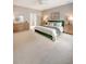 Spacious main bedroom with a green bed frame, stylish furnishings, and neutral color scheme at 23 Felix St, Charleston, SC 29403
