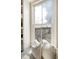 Bright window seat features white shelving and a beautiful view at 23 Felix St, Charleston, SC 29403