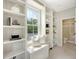 Bright window seat features white shelving and a view of the sky at 23 Felix St, Charleston, SC 29403
