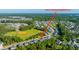 An aerial view shows the neighborhood, ball field and wooded area of 2314 Hummingbird Ln Myrtle Beach, SC 29579 at 2314 Hummingbird Ln, Summerville, SC 29483