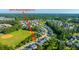 An aerial view shows the neighborhood, ball field and wooded area of 2314 Hummingbird Ln Myrtle Beach, SC 29579 at 2314 Hummingbird Ln, Summerville, SC 29483