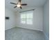 Spacious bedroom with a ceiling fan, large window, and wall-mounted television bracket at 2314 Hummingbird Ln, Summerville, SC 29483