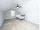 Attic bedroom with dormer window, ceiling fan, carpet, and bed at 2314 Hummingbird Ln, Summerville, SC 29483