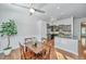 Bright dining area with natural light, wood floors, and open concept layout to the kitchen at 2314 Hummingbird Ln, Summerville, SC 29483