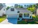 Charming home featuring a well-manicured lawn, attached garage, and inviting front porch at 2314 Hummingbird Ln, Summerville, SC 29483