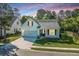 Charming home featuring a well-manicured lawn, attached garage, and inviting front porch at 2314 Hummingbird Ln, Summerville, SC 29483