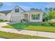 Charming home featuring manicured lawn, tidy flower beds, attached garage and inviting front porch at 2314 Hummingbird Ln, Summerville, SC 29483
