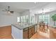 Spacious kitchen island with granite countertops, stainless steel appliances, and an adjacent dining area at 2314 Hummingbird Ln, Summerville, SC 29483