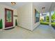 Inviting front porch with stylish front door, exterior lighting, and decorative plants at 2314 Hummingbird Ln, Summerville, SC 29483