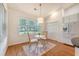 Cozy dining area with hardwood floors and natural light from the window at 2525 Bent Tree Ln, Mount Pleasant, SC 29464