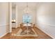 Elegant dining room with hardwood floors, a modern chandelier, and a view into the kitchen at 2525 Bent Tree Ln, Mount Pleasant, SC 29464