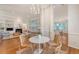Charming dining room featuring hardwood floors, modern light fixture, and open access to the living room at 2525 Bent Tree Ln, Mount Pleasant, SC 29464