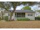Back exterior features a screened porch, patio, and leafy yard at 2525 Bent Tree Ln, Mount Pleasant, SC 29464