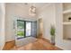 Inviting foyer featuring high ceilings, a modern light fixture, hardwood floors, and an open entrance at 2525 Bent Tree Ln, Mount Pleasant, SC 29464