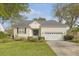 Beautiful single-story home with a manicured lawn, mature landscaping, and an attached two-car garage at 2525 Bent Tree Ln, Mount Pleasant, SC 29464