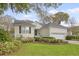 Charming single-story home featuring a well-manicured lawn and lush landscaping with a two-car garage at 2525 Bent Tree Ln, Mount Pleasant, SC 29464