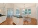 Bright kitchen boasts an island, a breakfast nook, and access to a screened porch at 2525 Bent Tree Ln, Mount Pleasant, SC 29464