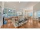 Inviting open-concept living room with hardwood floors, a fireplace, and large windows for ample natural light at 2525 Bent Tree Ln, Mount Pleasant, SC 29464