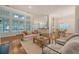 Spacious open concept living room with fireplace, hardwood floors and a large window offering plenty of natural light at 2525 Bent Tree Ln, Mount Pleasant, SC 29464
