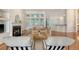 Open-concept living room boasting hardwood floors, a fireplace, and large windows for abundant natural light at 2525 Bent Tree Ln, Mount Pleasant, SC 29464