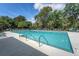 Community pool featuring a large pool deck with lounge chairs and mature trees at 2525 Bent Tree Ln, Mount Pleasant, SC 29464