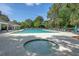 Community pool area featuring a hot tub, a pool deck, and a covered patio at 2525 Bent Tree Ln, Mount Pleasant, SC 29464