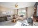 Cozy living room with comfortable seating, unique ceiling fan, and natural light at 259 Camellia Bloom Dr, Moncks Corner, SC 29461