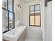 Double sink bathroom with vanity, modern lighting and fixtures, and a large window at 272 Coming St # C, Charleston, SC 29403