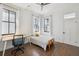 Bright bedroom with hardwood floors, a ceiling fan, and two windows for lots of natural light at 272 Coming St # C, Charleston, SC 29403