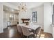 Bright dining room featuring a modern chandelier, white brick fireplace, and a marble-topped table at 272 Coming St # C, Charleston, SC 29403
