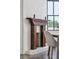 Close-up of a charming fireplace in the dining room with original mantle at 272 Coming St # C, Charleston, SC 29403