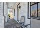 Inviting front porch with whitewashed brick and comfortable seating to enjoy the outdoors at 272 Coming St # C, Charleston, SC 29403