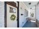 Charming front porch with seating and views of the neighborhood at 272 Coming St # C, Charleston, SC 29403