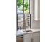 Kitchen with a modern sink and faucet, quartz countertops, stainless steel appliances and bright window at 272 Coming St # C, Charleston, SC 29403