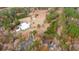 An aerial view shows a property with a home, pond, and a mix of green and fall-colored trees at 280 Royalegates Ct, Cross, SC 29436